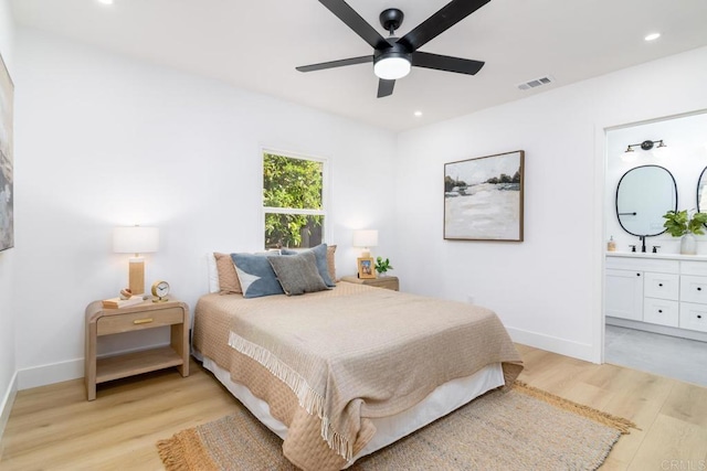 444547 N 42nd St, San Diego, CA 92116 - bedroom with light wood-style flooring, baseboards, recessed lighting, ensuite bath, and a sink