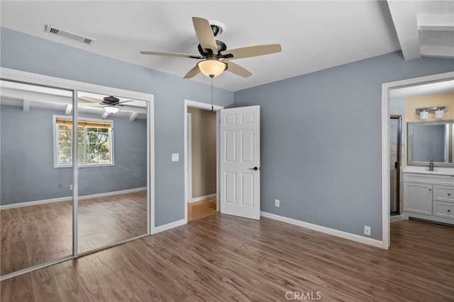 15711 Hiawatha St, Granada Hills, CA 91344 - unfurnished bedroom featuring wood finished floors, baseboards, a sink, and a closet