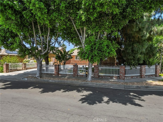 15711 Hiawatha St, Granada Hills, CA 91344 - view of property hidden behind natural elements featuring brick siding