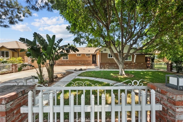 15711 Hiawatha St, Granada Hills, CA 91344 - ranch-style home featuring stucco siding, concrete driveway, and brick siding