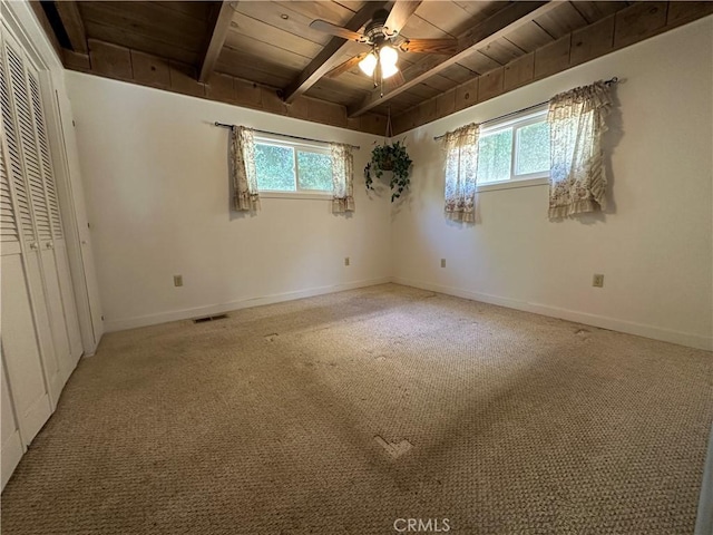 20853 Lyons Bald Mountain Rd, Sonora, CA 95370 - unfurnished bedroom with wood ceiling with exposed beams, multiple windows, light carpet, and baseboards