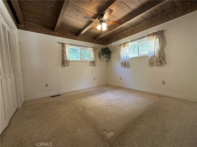 20853 Lyons Bald Mountain Rd, Sonora, CA 95370 - unfurnished bedroom with wooden ceiling with exposed beams, multiple windows, carpet flooring, and baseboards
