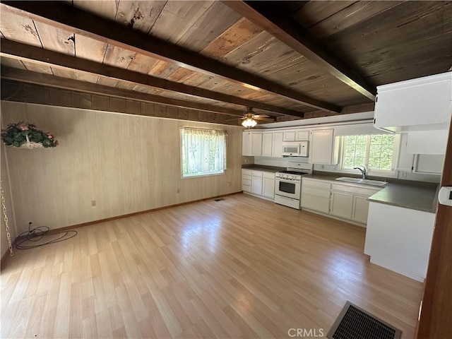 20853 Lyons Bald Mountain Rd, Sonora, CA 95370 - kitchen with white appliances, wood ceiling with exposed beams, a sink, light wood-type flooring, and white cabinetry