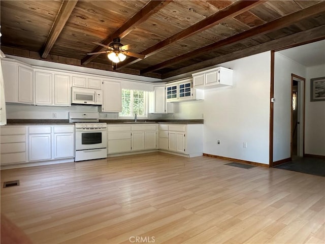 20853 Lyons Bald Mountain Rd, Sonora, CA 95370 - kitchen with white appliances, wooden ceiling with exposed beams, dark countertops, light wood-style flooring, and a ceiling fan