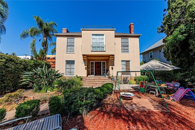 1151 Arapahoe St, Los Angeles, CA 90006 - back of property featuring a chimney and stucco siding