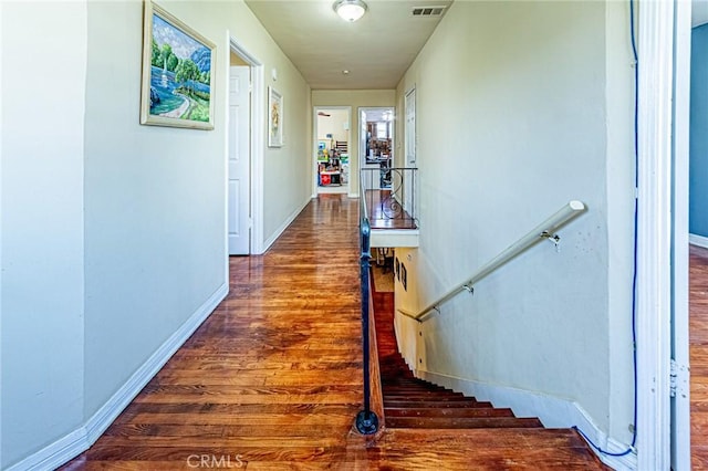 1151 Arapahoe St, Los Angeles, CA 90006 - corridor with wood finished floors, an upstairs landing, and baseboards