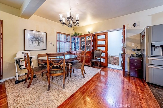1151 Arapahoe St, Los Angeles, CA 90006 - dining area featuring wood-type flooring and a chandelier