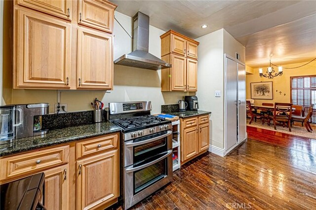 1151 Arapahoe St, Los Angeles, CA 90006 - kitchen with wall chimney exhaust hood, range with two ovens, a chandelier, dark wood-style floors, and recessed lighting