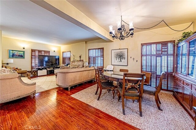 1151 Arapahoe St, Los Angeles, CA 90006 - dining room featuring a chandelier and wood finished floors