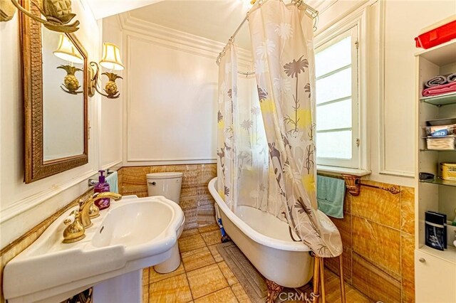 1151 Arapahoe St, Los Angeles, CA 90006 - bathroom with healthy amount of natural light, a bath, a shower with curtain, tile patterned floors, and tile walls