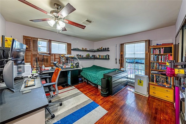 1151 Arapahoe St, Los Angeles, CA 90006 - bedroom with wood finished floors, a desk, and ceiling fan