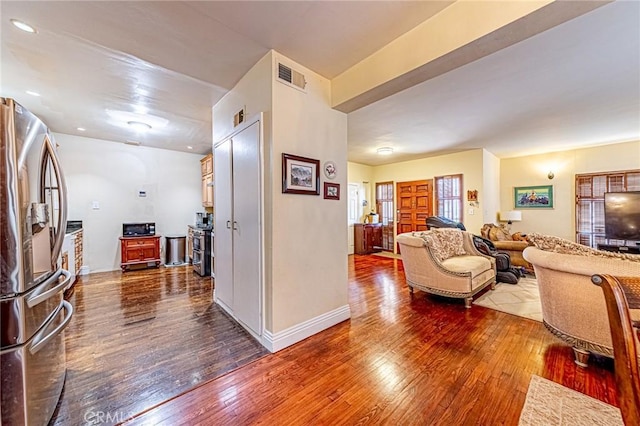 1151 Arapahoe St, Los Angeles, CA 90006 - living area with dark wood-type flooring and baseboards