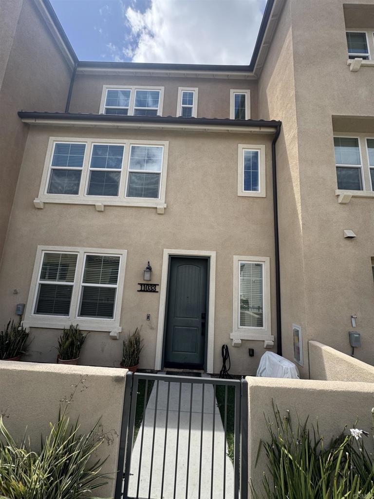 11033 Bryce Way, San Diego, CA 92129 - view of front facade with a fenced front yard, stucco siding, and a gate
