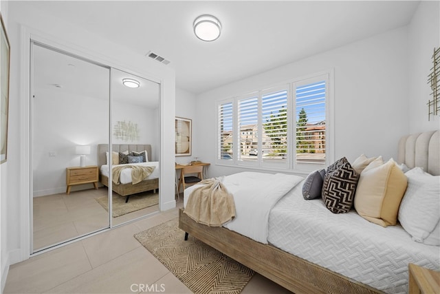 1844 Aliso Canyon Dr, Lake Forest, CA 92610 - bedroom featuring a closet, light tile patterned floors, and baseboards