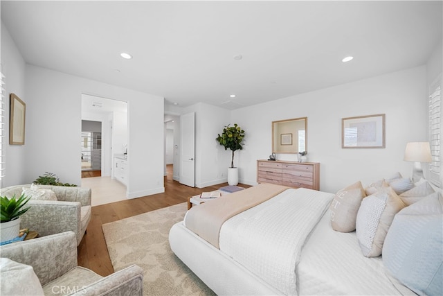 1844 Aliso Canyon Dr, Lake Forest, CA 92610 - bedroom with light wood-style floors, recessed lighting, baseboards, and ensuite bath