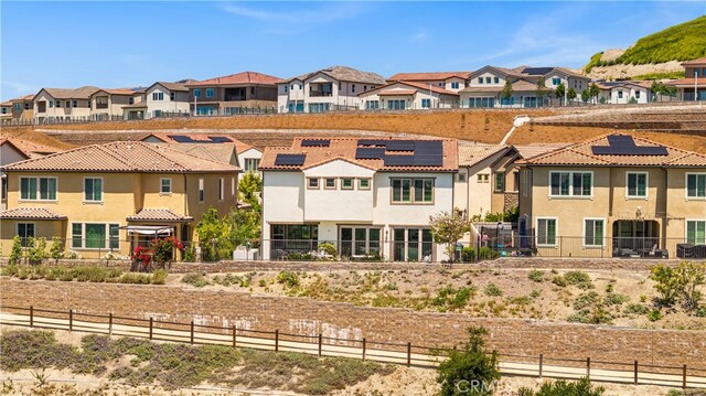 1844 Aliso Canyon Dr, Lake Forest, CA 92610 - view of front of home with a residential view, a tile roof, and stucco siding