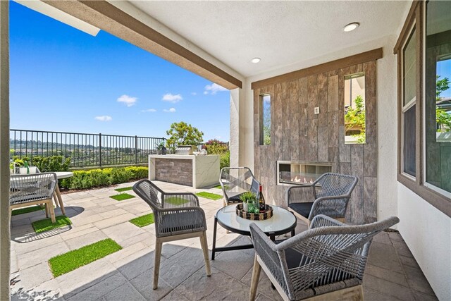 1844 Aliso Canyon Dr, Lake Forest, CA 92610 - view of patio / terrace with an outdoor living space with a fireplace