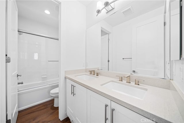 1844 Aliso Canyon Dr, Lake Forest, CA 92610 - bathroom featuring toilet, double vanity, wood finished floors, and shower / bath combination