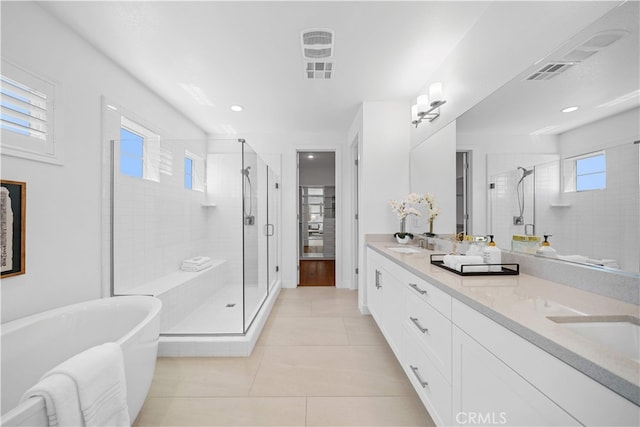 1844 Aliso Canyon Dr, Lake Forest, CA 92610 - bathroom with a stall shower, double vanity, a soaking tub, tile patterned flooring, and recessed lighting