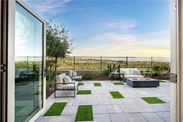 1844 Aliso Canyon Dr, Lake Forest, CA 92610 - patio terrace at dusk featuring an outdoor fire pit, a patio, and a fenced backyard