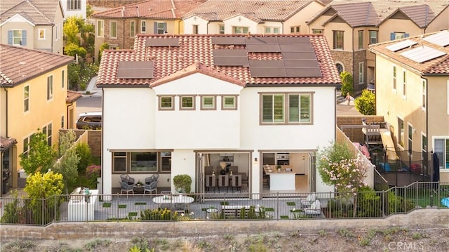 1844 Aliso Canyon Dr, Lake Forest, CA 92610 - view of front of home with solar panels, stucco siding, a residential view, and a tiled roof