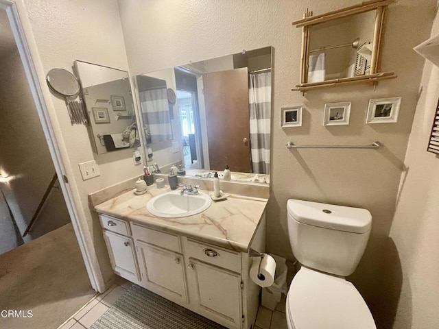 2711 S El Camino Real Unit 7, San Clemente, CA 92672 - full bath with toilet, a textured wall, vanity, tile patterned flooring, and curtained shower