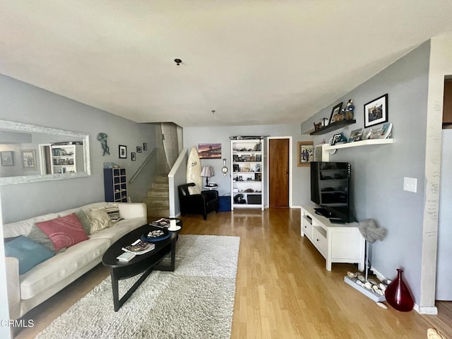 2711 S El Camino Real Unit 7, San Clemente, CA 92672 - living area with stairway and light wood finished floors