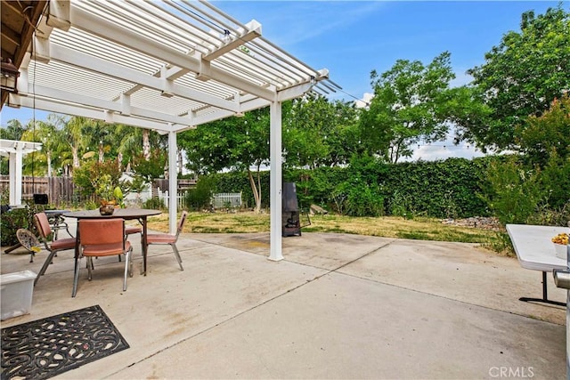 1457 Quiet Ct, Merced, CA 95340 - fenced backyard with outdoor dining area, a pergola, and a patio