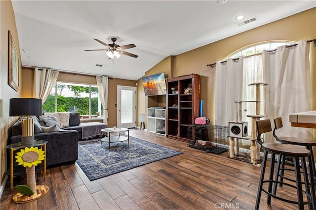 1457 Quiet Ct, Merced, CA 95340 - living area featuring ceiling fan, wood finished floors, and vaulted ceiling