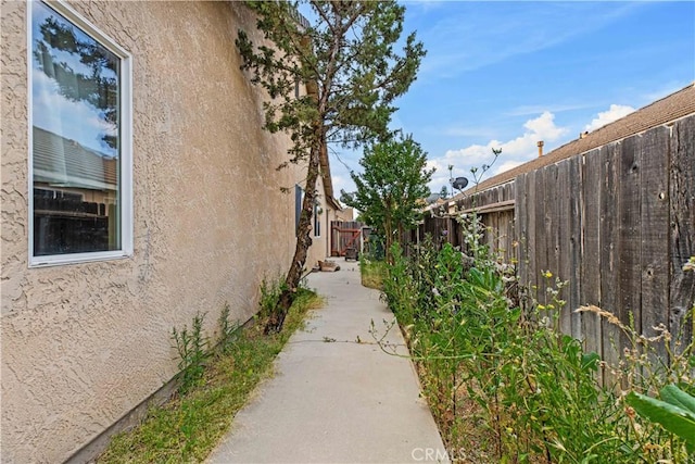 1457 Quiet Ct, Merced, CA 95340 - view of home's exterior with stucco siding and a fenced backyard