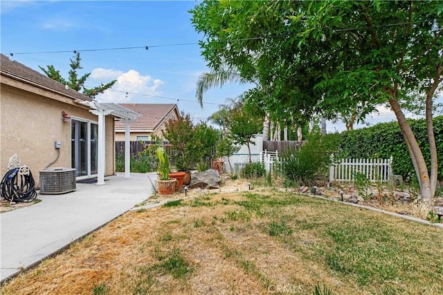 1457 Quiet Ct, Merced, CA 95340 - view of yard featuring a pergola, a patio, and central AC