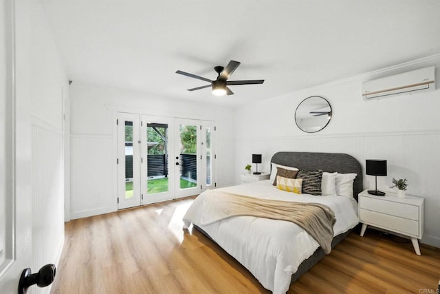 4848 54th St, San Diego, CA 92115 - bedroom featuring a wall mounted air conditioner, access to exterior, wood finished floors, and a ceiling fan