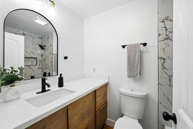4848 54th St, San Diego, CA 92115 - full bathroom with vanity, toilet, and a marble finish shower