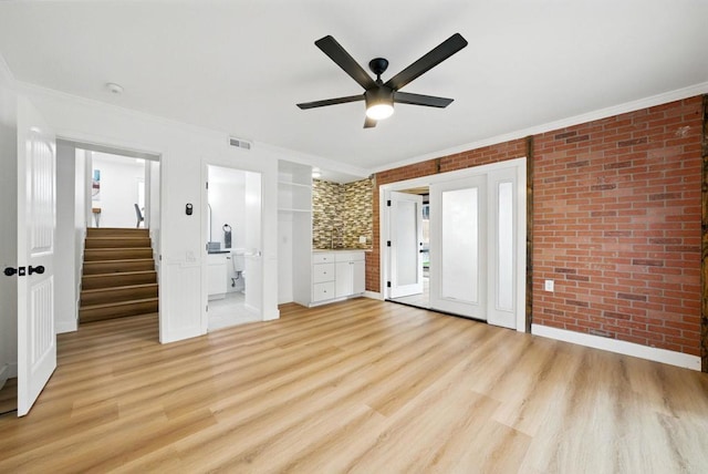 4848 54th St, San Diego, CA 92115 - unfurnished bedroom featuring brick wall, crown molding, light wood-type flooring, ceiling fan, and ensuite bath