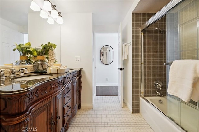 2383 Via Mariposa W Unit C, Laguna Woods, CA 92637 - bathroom with bath / shower combo with glass door, tile patterned floors, and vanity