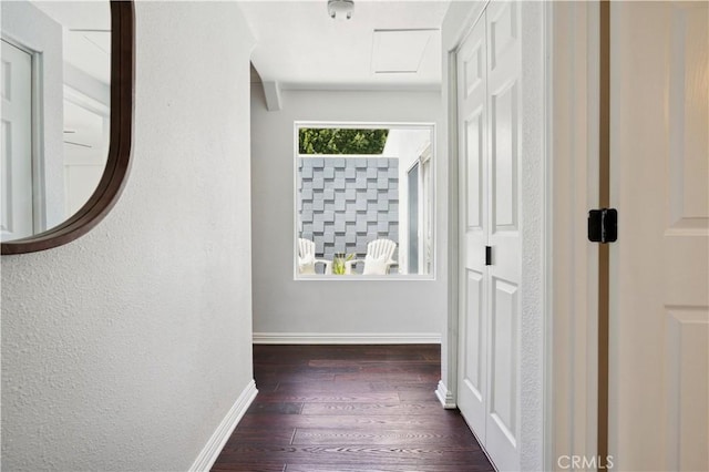 2383 Via Mariposa W Unit C, Laguna Woods, CA 92637 - hallway featuring baseboards, wood finished floors, and attic access