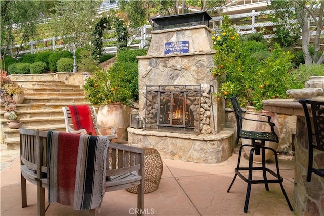 5558 Hoback Glen Rd, Hidden Hills, CA 91302 - view of patio featuring an outdoor stone fireplace