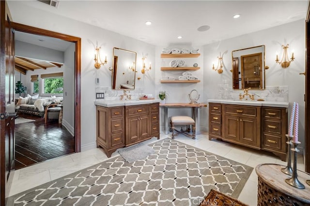 5558 Hoback Glen Rd, Hidden Hills, CA 91302 - bathroom with tasteful backsplash, two vanities, ensuite bath, recessed lighting, and marble look tile flooring