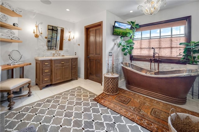 5558 Hoback Glen Rd, Hidden Hills, CA 91302 - bathroom featuring vanity, a freestanding bath, recessed lighting, baseboards, and tile patterned flooring