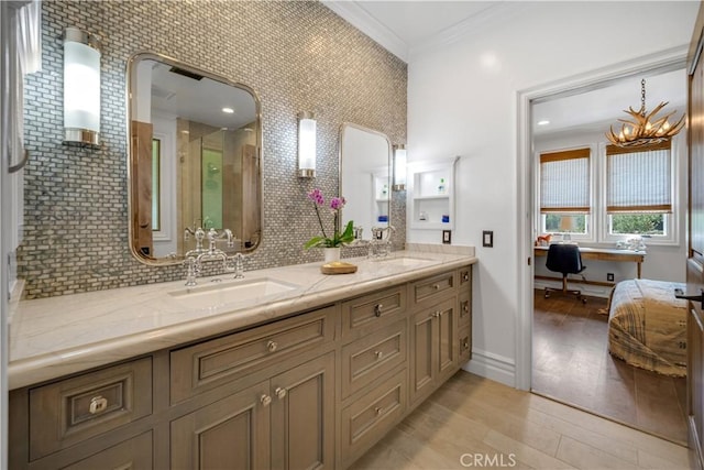 5558 Hoback Glen Rd, Hidden Hills, CA 91302 - full bathroom featuring crown molding, wood finished floors, a stall shower, backsplash, and double vanity