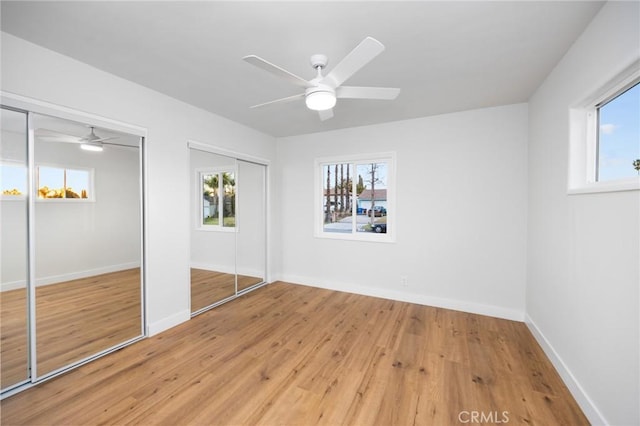 16243 Doublegrove St, La Puente, CA 91744 - unfurnished bedroom with multiple closets, multiple windows, light wood finished floors, and baseboards