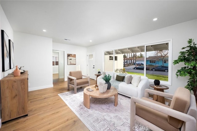 16243 Doublegrove St, La Puente, CA 91744 - living room featuring light wood finished floors, recessed lighting, and baseboards