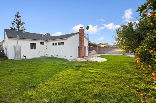 16243 Doublegrove St, La Puente, CA 91744 - rear view of house with stucco siding, a chimney, central AC, and crawl space