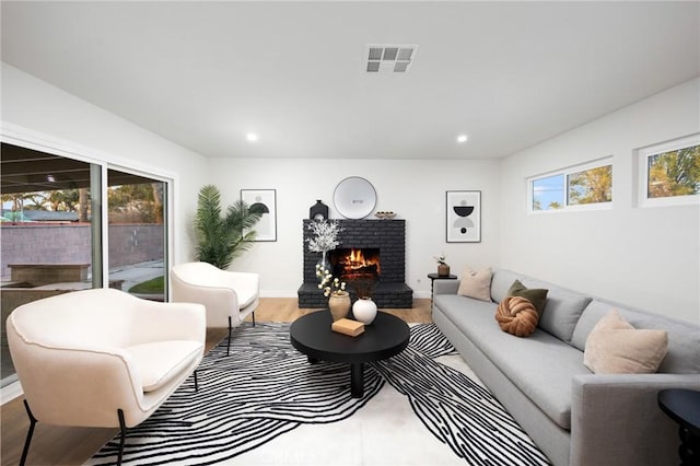 16243 Doublegrove St, La Puente, CA 91744 - living area with a fireplace, wood finished floors, and recessed lighting