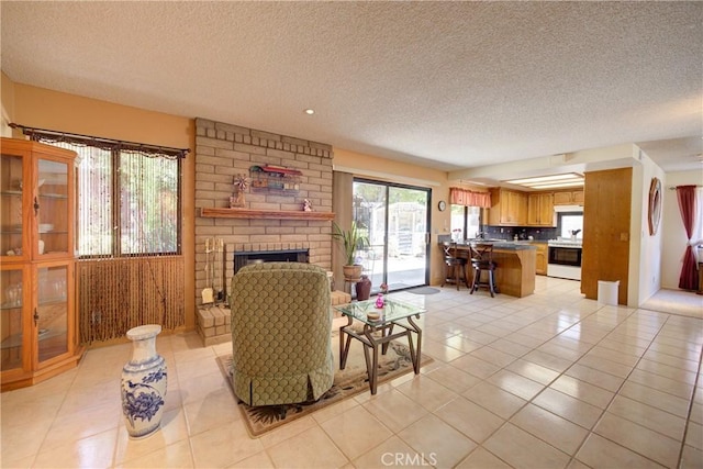 4185 Vanguard Dr, Lompoc, CA 93436 - living room with light tile patterned flooring, a textured ceiling, and a brick fireplace
