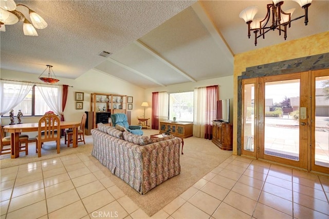 4185 Vanguard Dr, Lompoc, CA 93436 - living area featuring light tile patterned flooring, vaulted ceiling, a chandelier, and a textured ceiling