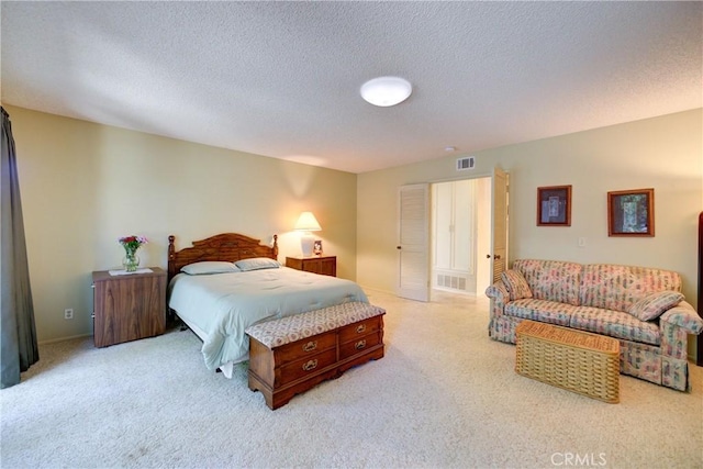 4185 Vanguard Dr, Lompoc, CA 93436 - bedroom with light colored carpet and a textured ceiling