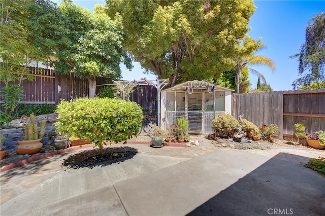 4185 Vanguard Dr, Lompoc, CA 93436 - fenced backyard featuring a patio area and an outdoor structure