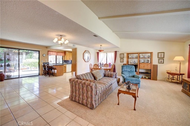 4185 Vanguard Dr, Lompoc, CA 93436 - living room with a textured ceiling, healthy amount of natural light, light tile patterned floors, and a chandelier