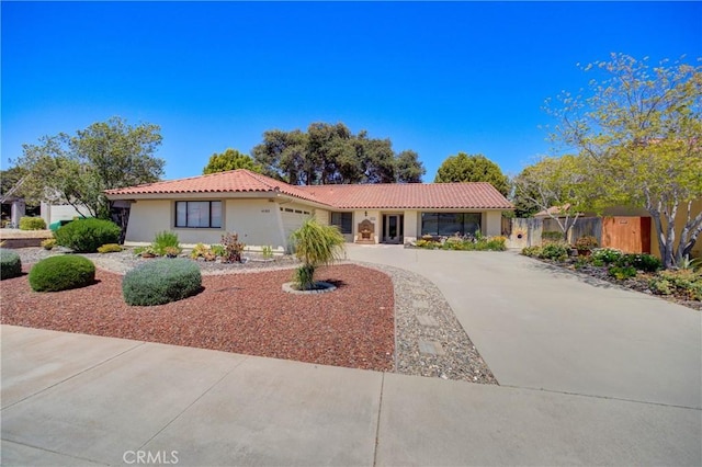 4185 Vanguard Dr, Lompoc, CA 93436 - view of front facade with an attached garage, driveway, a tile roof, and stucco siding